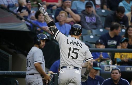 Chicago White Sox' Brett Lawrie points to the stands as he heads to the dugout after hitting a solo home run against the Seattle Mariners in the second inning of a baseball game, Tuesday, July 19, 2016, in Seattle. (AP Photo/Ted S. Warren)