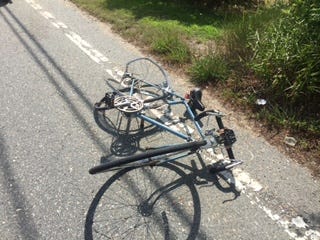 A bicycle lies on the ground on Middleboro Road in Freetown. The rider was struck by a car and critically injured.