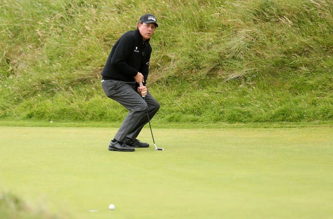 Phil Mickelson reacts after missing a putt on the 7th green during Sunday's final round of the British Open at the Royal Troon Golf Club in Troon, Scotland. Mickelson lost by three strokes to Henrik Stenson - Mickelson's 11th runner-up finish at a major. Only Jack Nicklaus, with 19, has more.