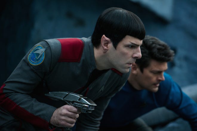 Spock and Bones (Zachary Quinto and Karl Urban) try to find the rest of the Enterprise crew after a crash landing. (Paramount Pictures)