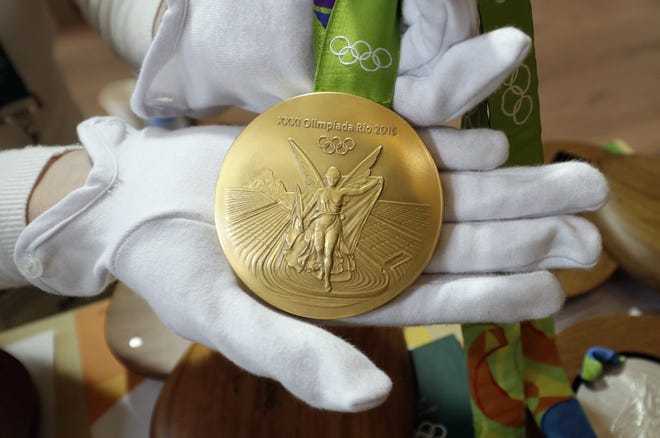 A 2016 Olympic gold medal is displayed at Olympic Park on Wednesday in Rio de Janeiro. AP Photo