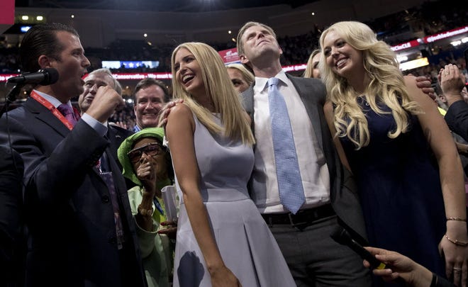 Republican Presidential Candidate Donald Trump's children Donald Trump Jr., Ivanka Trump, Eric Trump and Tiffany Trump celebrate on the convention floor on Tuesday during the second day session of the Republican National Convention in Cleveland.