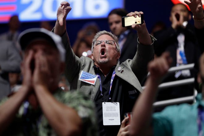People react to Sen. Ted Cruz, R-Tex., as Cruz addresses the delegate during the third day session of the Republican National Convention in Cleveland, Wednesday, July 20, 2016. (AP Photo/Matt Rourke)