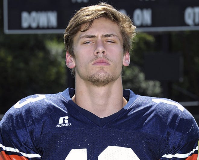 In this July 31, 2015 photo, Jerry Greer, son of country music singer Craig Morgan, poses for a photo in his high school football uniform in Dickson, Tenn. The body of Greer, 19, was found July 11, after what authorities described as a weekend boating accident. (Marty Allison/The Dickson Herald via AP)