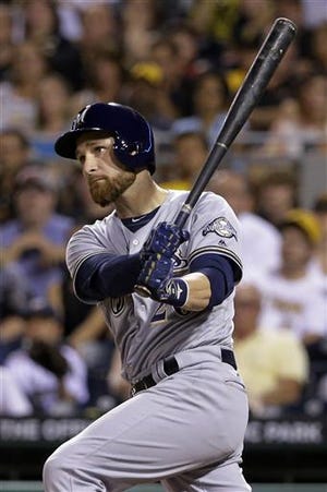 Milwaukee Brewers' Jonathan Lucroy drives in two runs with a single off Pittsburgh Pirates relief pitcher A.J. Schugel in the sixth inning of a baseball game in Pittsburgh, Wednesday, July 20, 2016. (AP Photo/Gene J. Puskar)