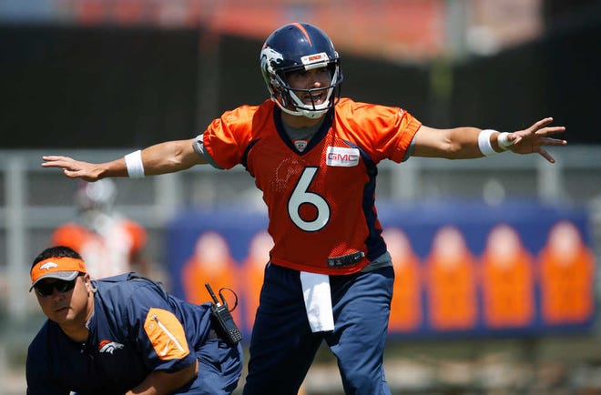 FILE - In this June 7, 2016, file photo, Denver Broncos quarterback Mark Sanchez calls a play before taking the snap during an NFL football practice at the team's headquarters in Englewood, Colo. One of the last things an NFL team needs when it enters training camp is uncertainty at quarterback. (AP Photo/David Zalubowski, File)