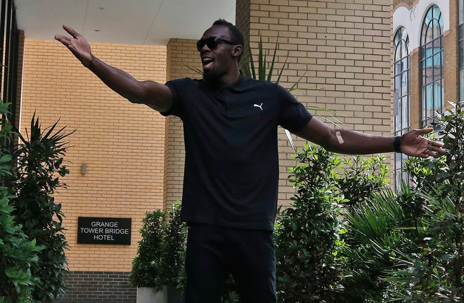 Jamaican athlete Usain Bolt poses for photographers before a press conference ahead of the MÃ¼ller Anniversary Games in London, Thursday, July 21, 2016.