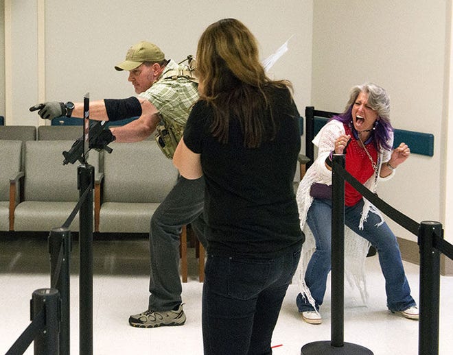 The employees of Clark Clinic participate in an active shooter drill June 5, 2015. the exercise is desinged to help train staff members on what to do in the event of an active shooter in the hospital.