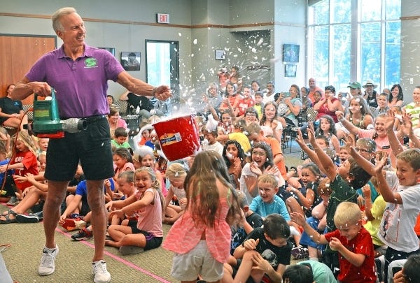 Children enjoy “Martian snow,” provided by National Science Presenter Stephen “Super Steve” Cox at the Fort Smith Public Library on Wednesday, July 20, 2016. The program is part of the library’s Wonderful Wednesday events. BRIAN D. SANDERFORD/TIMES RECORD