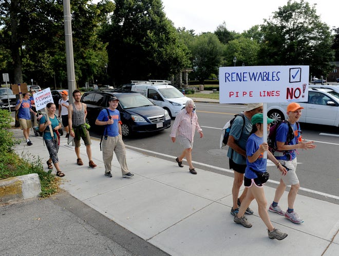 Members of 350 Massachusetts march through Walpole center on Thursday July 14. A few dozen people marched and protested against the Q1 Loop natural gas pipeline, during which protesters walked the entire proposed pipeline route, starting in Medway.

Wicked Local Staff Photo/David Gordon