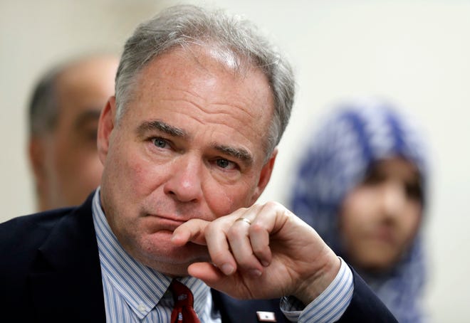 Sen. Tim Kaine, D-Va., listens to community leaders at a roundtable discussion on religious freedom with the regional interfaith community at All Dulles Area Muslim Society (ADAMS) Mosque in Sterling, Va., Thursday, July 21, 2016. (AP Photo/Manuel Balce Ceneta)