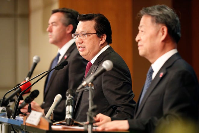 From left to right; Australia's Minister for Infrastructure and Transport Darren Chester, Malaysia's Minister of Transport Liow Tiong Lai, and China's Minister of Transport Yang Chuantang speaks on the Malaysia Airlines Flight 370 during a join press conference in Putrajaya, Malaysia, Friday, July 22, 2016. Malaysia, Australia and China have agreed to suspend the search for Flight 370 once the current area in the Indian Ocean has been completely scoured for the missing Malaysia Airlines jetliner. (AP Photo/Vincent Thian)