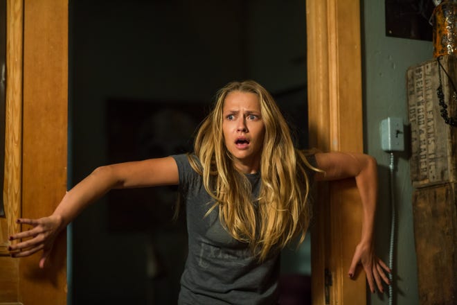 Rebecca (Teresa Palmer) should consider reaching for that light switch in “Lights Out.” (Atomic Monster)