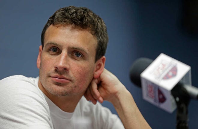 FILE - In this May 12, 2016, file photo, Ryan Lochte listens to a question from the media in Charlotte, N.C. Missy Franklin and Ryan Lochte will be busy in the pool at the Rio Olympics. Just not as busy as they wanted to be. The two popular stars from the U.S. swimming team four years ago in London have just three individual events between them in Rio, hardly the frenetic schedule they've grown accustomed to over the years. (AP Photo/Chuck Burton, File)