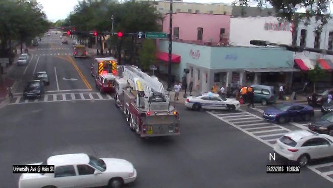 This photo provided by Gainesville/Alachua County Smarttraffic shows an accident in which a car drove into a pole and a building at University Avenue and Main Street Friday afternoon.