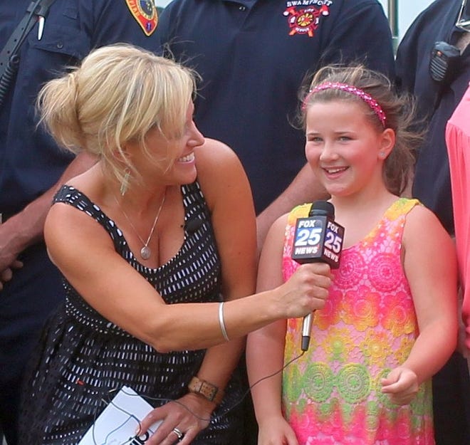 FOX25 Around Town host Michele Lazcano interviews Swampscott's hometown hero, Victoria Pierro, during the station's Zip Trip broadcast on the town hall lawn, Friday, July 22. Wicked Local Photo/ Greg Phipps