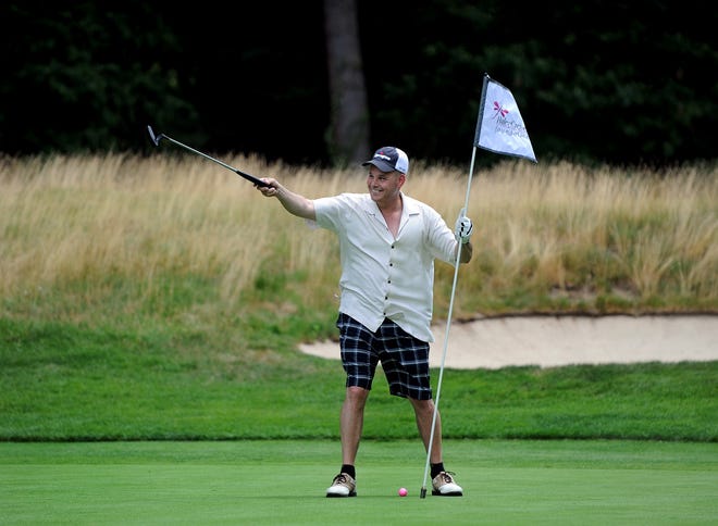Gus Pesaturo of Bridgewater celebrates his friend's second hole putt during the second annual Haley Cremer Foundation Golf Tournament at the Brookmeadow Country Club in Canton July 15.

Wicked Local staff photo/David Gordon