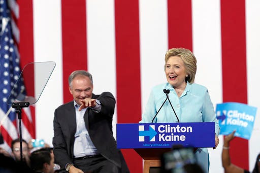 Democratic presidential candidate Hillary Clinton is joined by Sen. Tim Kaine, D-Va., as she speaks at a rally at Florida International University Panther Arena in Miami, Saturday, July 23, 2016. Clinton has chosen Kaine to be her running mate. -(AP Photo/Mary Altaffer)