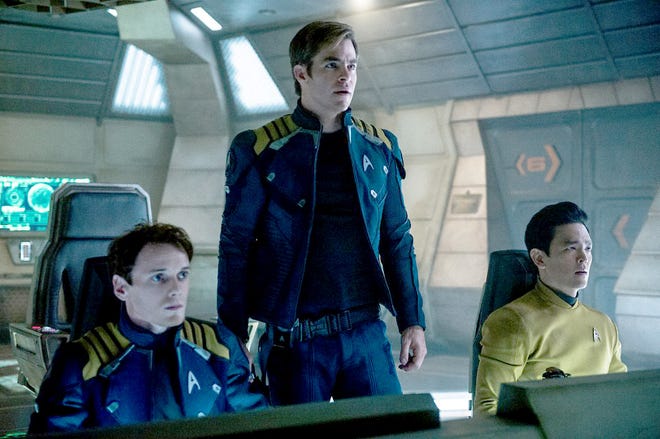 John Cho (Sulu), right, says he will celebrate the young career of Anton Yelchin (Chekov), left, through his body of work. Yelchin died last month. Chris Pine, center, plays Kirk in “Star Trek Beyond.” MUST CREDIT: Kimberley French, Paramount Pictures