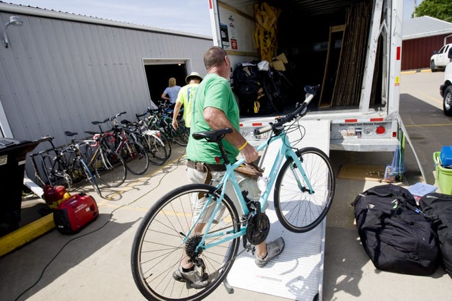 Roger Siefken loads bikes onto a truck Friday at Bickel’s in West Burlington in preparation for this year’s RAGBRAI. This year’s ride begins Sunday in Glenwood.