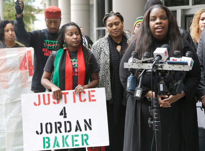Janet Baker, right, speaks to reporters during a press conference outside the federal courthouse on Dec. 2, 2015 in Houston.