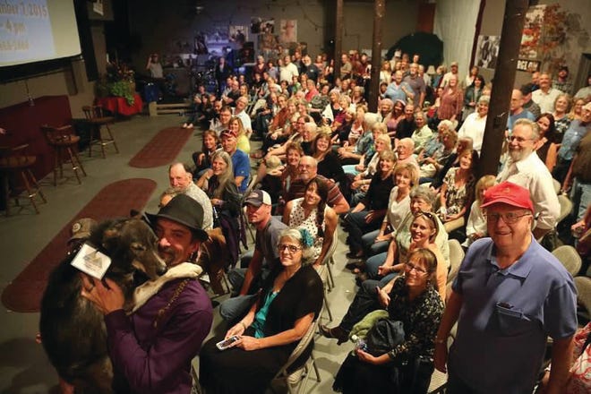 Lance Mackey and his dog, Amp, are pictured above at left during the sold out opening of “The Great Alone” at last year's Jefferson State Flixx Festival. The movie tells the story of Mackey's travels as a dog sled operator.