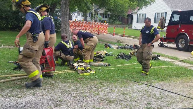 Topeka firefighters dealt with a 101-degree heat index as they worked Saturday to put out a house blaze at 2621 S.W. 7th.