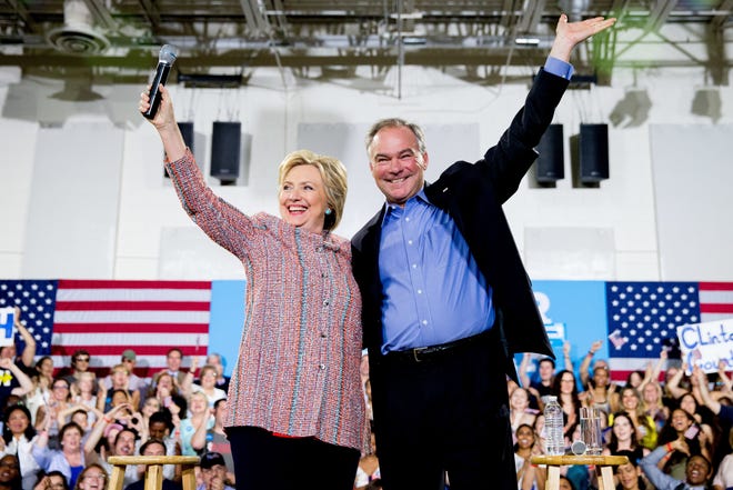 Democratic presidential candidate Hillary Clinton is accompanied by Sen. Tim Kaine, D-Va., at a July 14 rally at Northern Virginia Community College in Annandale, Va. The Associated Press