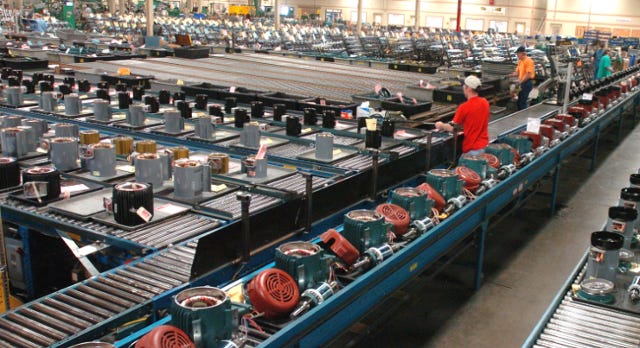 Baldor Electric Co. employees prepare motors for distribution at the Fort Smith plant in March 2008. Times Record file photo