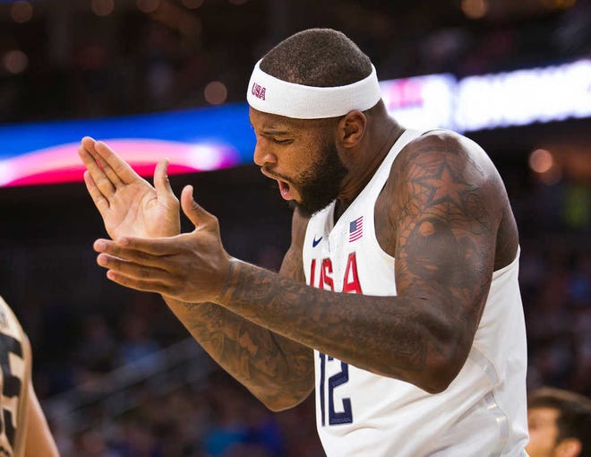 DeMarcus Cousins (12) celebrates a basket against Argentina during an exhibition game on Friday in Las Vegas.