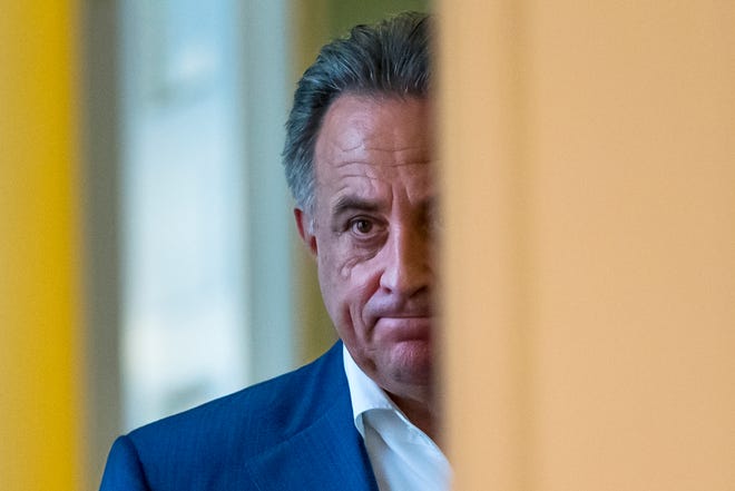 Russian Sports Minister Vitaly Mutko enters a hall to speak to the media in Moscow, Russia, Sunday, July 24, 2016. Olympic leaders stopped short Sunday of imposing a complete ban on Russia competing in the Rio de Janeiro Olympic Games, handing individual global sports federations the responsibility to decide which athletes should be cleared to compete.