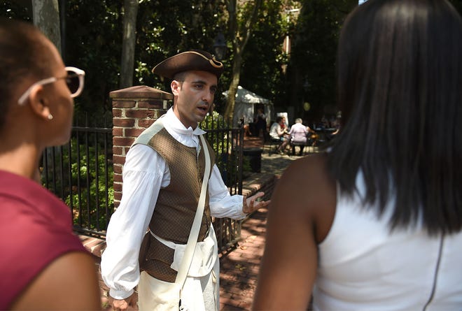 Matt Muto, of Philadelphia, a historical interpreter at the Betsy Ross House, speaks to festival-goers during Philly Feast in Old City at 3rd and Arch Streets in Philadelphia on Monday, July 25, 2016. The festival was on closed-off streets from 11 a.m. to 3 p.m.