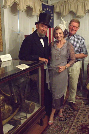 From left, Bruce McAdam, Noreen Biehl and James Verschueren are all smiles during the Woodman Museum's Centennial event on Saturday night in Dover. Beau Davis/Fosters.com