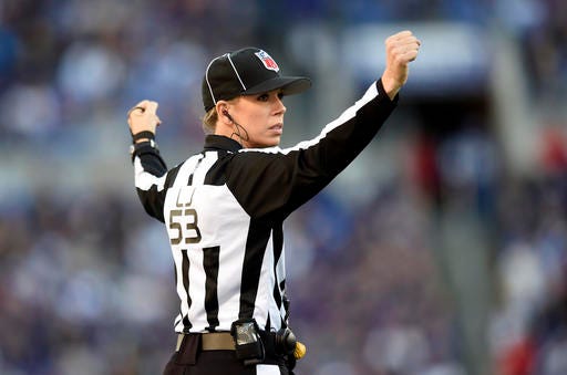 FILE - In this Nov. 15, 2015 file photo, NFL official Sarah Thomas signals in the second half of an NFL football game between the Baltimore Ravens and the Jacksonville Jaguars in Baltimore. Thomas, who was the first female to be a full-time game official in the NFL will again be the NFL's only female game official in 2016. (AP Photo/Gail Burton, file)