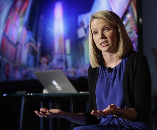 FILE - In this Monday, May 20, 2013, file photo, Yahoo CEO Marissa Mayer speaks during a news conference in New York. On Monday, July 25, 2016, Verizon formally announced that it is buying Yahoo for $4.83 billion, marking the end of an era for a company that once defined the internet. (AP Photo/Frank Franklin II, File)