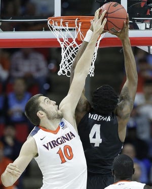 Mike Tobey, left, played four years for Virginia.