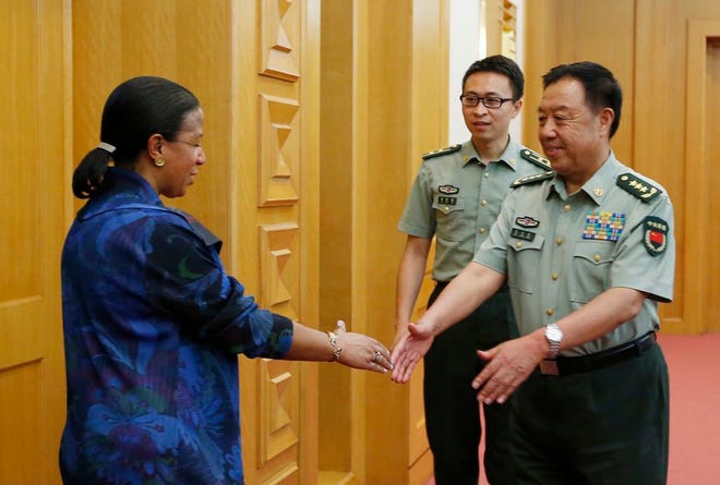 U.S. National Security Adviser Susan Rice, left, is greeted by China's Central Military Commission Vice Chairman Fan Changlong at the Bayi Building in Beijing, China, on Monday, July 25, 2016.