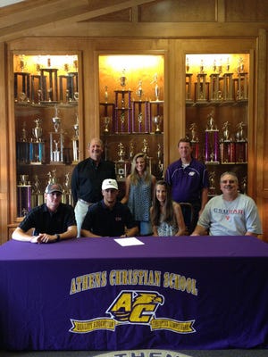 Athens Christian's Dewitt Wood signed with Columbus State for track and field Saturday.
