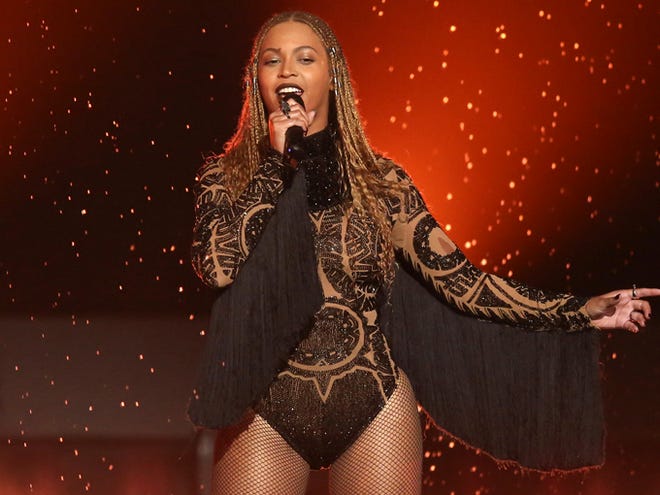 FILE - In this June 26, 2016 file photo, Beyonce performs 'Freedom' at the BET Awards in Los Angeles. Beyonce and Adele are the top nominees at the MTV Video Music Awards, where their music videos will compete against Kanye West's controversial “Famous” for video of the year. The VMAs will air live Aug. 28 from New York's Madison Square Garden.