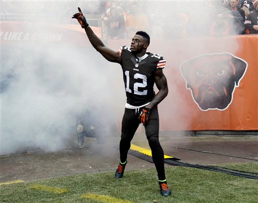 File-This Dec. 14, 2014, file photo shows Cleveland Browns wide receiver Josh Gordon being introduced before an NFL football game against the Cincinnati Bengals in Cleveland. Gordon is expected to miss at least two weeks of training camp with a quadriceps injury, the latest setback for the troubled player. Gordon, who was reinstated on Monday by NFL Commissioner Roger Goodell following a lengthy suspension for drug violations, took a physical on Tuesday, July 26, 2016, and it was determined he will need time to recover from an injury sustained while working out on his own. (AP Photo/Tony Dejak, File)