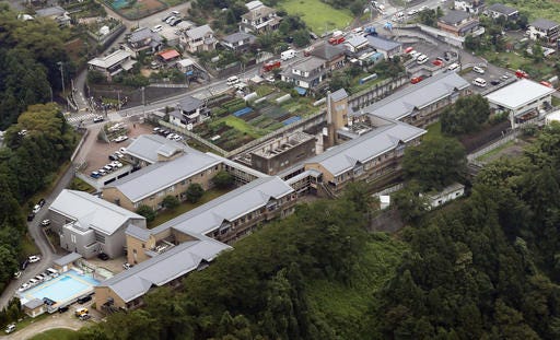 This aerial view shows Tsukui Yamayuri-en, a facility for the handicapped where a number of people were killed and dozens injured in a knife attack Tuesday, July 26, 2016, in Sagamihara, outside Tokyo. (Kyodo News via AP)