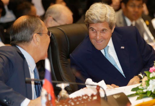 Russia's Foreign Minister Sergey Lavrov, left, talks with U.S. Secretary of State John Kerry during the 6th East Asia Summit Foreign Minister's meeting in Vientiane, Laos, Tuesday, July 26, 2016. (AP photo/Sakchai Lalit)