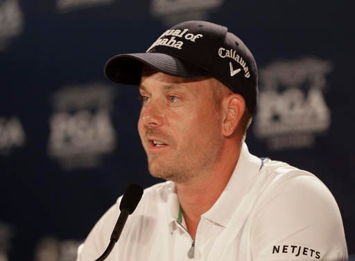 2016 British Open champion Henrik Stenson answers a question during a news conference after a practice round for the PGA Championship golf tournament at Baltusrol Golf Club in Springfield, N.J., Tuesday, July 26, 2016. (AP Photo/Chuck Burton)