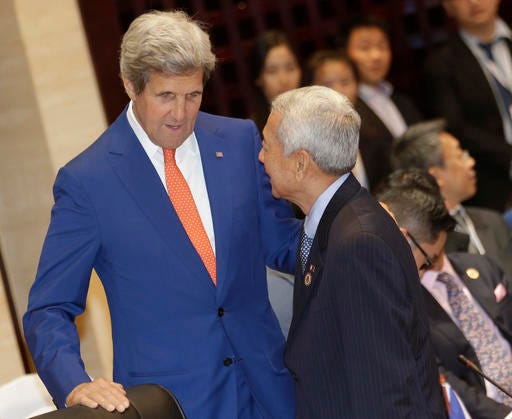 U.S. Secretary of State John Kerry, left, talks to Philippine Foreign Secretary Perfecto Yasay Jr. before the Association of Southeast Asian Nations (ASEAN)-U.S. Foreign Ministers Meeting in Vientiane, Laos, Monday, July 25, 2016. Southeast Asia's main grouping made a last-ditch attempt to reach a consensus on countering China's territorial expansion in the South China Sea, but their deadlock appeared far from being resolved as minutes ticked by before a critical meeting with the Chinese foreign minister Monday. (AP Photo/Sakchai Lalit)