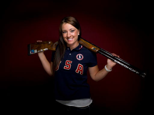 FILE - In this May 14, 2012, file photo, Corey Cogdell poses for a portrait at the 2012 Team USA media summit in Dallas. Codgell-Unrein needed extra protection after someone posted hunting videos on her Facebook page without her knowledge. A two-time Olympian, she grew up in Alaska, where the family hunted for its food, and still hunts. Despite saying she didn't agree with the content of the videos, Codgell-Unrein received numerous death threats before the Olympics. (AP Photo/Victoria Will, File)