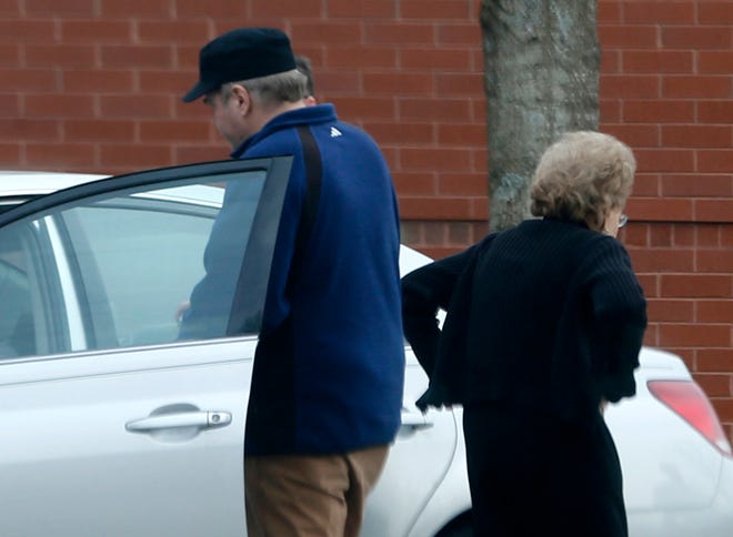 FILE - In this March 19, 2015 file photo, John Hinckley gets into his mother's car in front of a recreation center in Williamsburg, Va. A judge says Hinckley, who attempted to assassinate President Ronald Reagan will be allowed to leave a Washington mental hospital and live full-time in Virginia. (AP Photo/ Steve Helber, File)