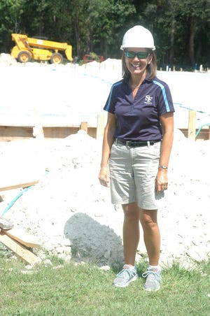 Anthony Garzilli/Jasper County Sun TimesSFCA Principal Donna Carter is all smiles because the school's new gym is scheduled to be completed by November. Ground broke for the 15,000-square-foot facility last spring.