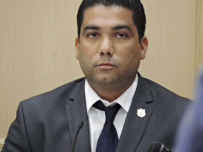 In this June 16, 2016, file photo, Peter Peraza, a Broward County sheriff's deputy testifies at his trial in Fort Lauderdale, Fla. A judge has dismissed a manslaughter charge, Wednesday, July 27, 2016, against Peraza, who claimed self-defense in the 2014 fatal shooting of a black man carrying what turned out to be an air rifle.