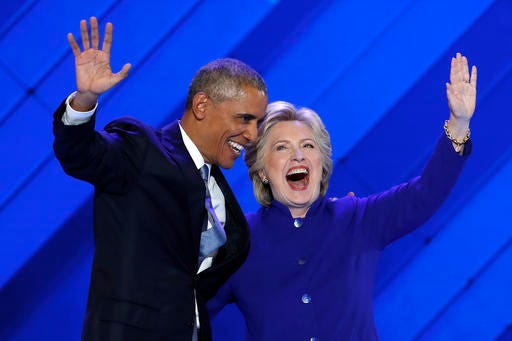 President Barack Obama and Democratic Presidential nominee Hillary Clinton wave to delegates after President Obama's speech during the third day of the Democratic National Convention in Philadelphia , Wednesday, July 27, 2016. (AP Photo/J. Scott Applewhite)