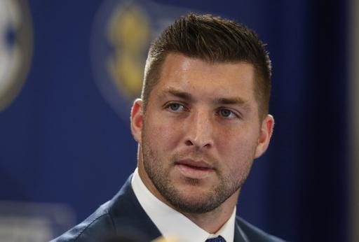 FILE - In this Dec. 5, 2014, file photo, Tim Tebow speaks during an SEC television broadcast in Atlanta. Tim Tebow will not call himself a retired football player though he could see himself as a future coach. A career in politics is also something that could be appealing down the road. "I think I consider myself someone that is so blessed to do what I love to do and to be around the game of college football and to be able to be part of something that was so much a part of my life since I was a little boy," Tebow said Wednesday, July 27, 2016. "But also I've got a lot of different things going on right now." (AP Photo/Brynn Anderson, File)